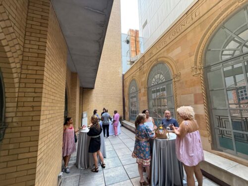 people mingling in the ArtsW Outdoor Courtyard