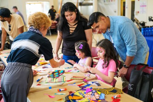Family and kids doing artwork