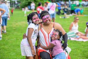 woman and 2 girls with painted faces